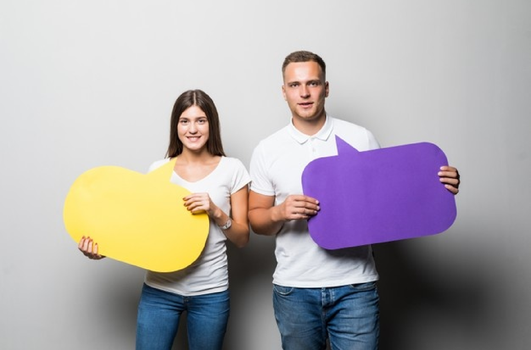 smiling couple holding yellow blue chat clouds their hands isolated white background 231208 9408 3